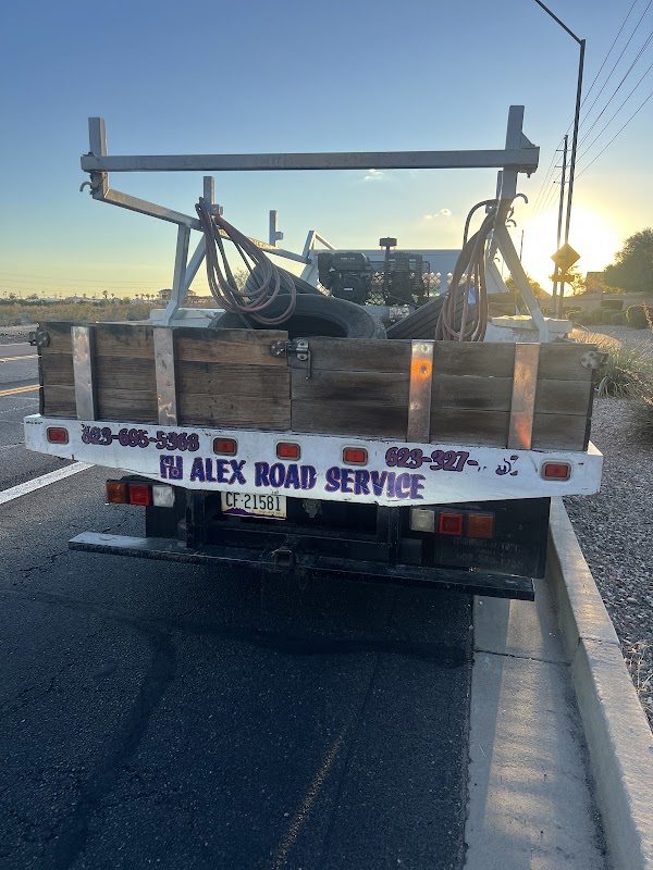 Alex Road Service truck at sunset on highway